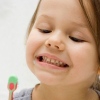 Желтый налет на зубах у ребенка: причины и методы борьбы
